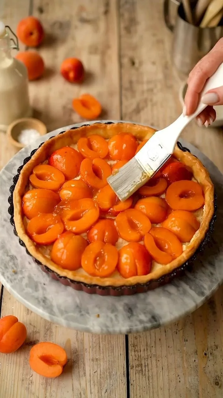 Homemade apricot tart with golden crust and fresh apricot filling