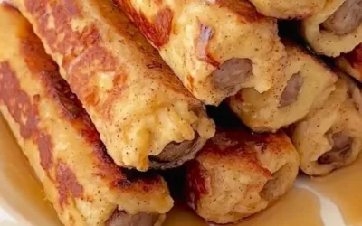 Delicious French Toast Roll-Ups filled with sweet cream cheese and berries