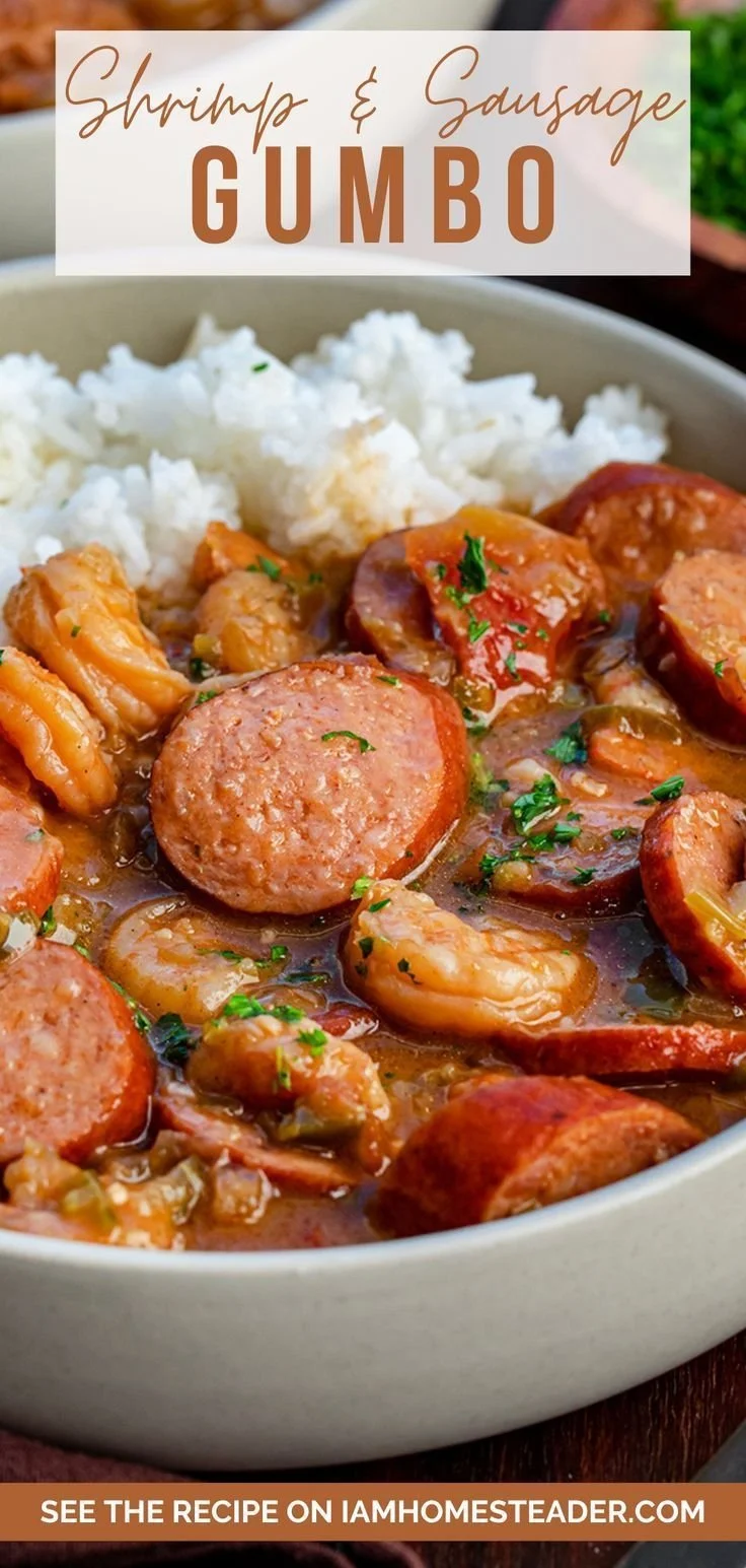 A bowl of hearty gumbo with shrimp, sausage, and vegetables served with rice.